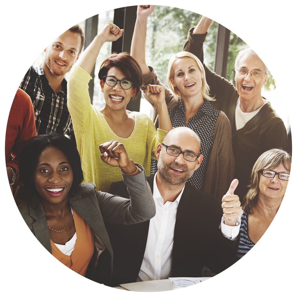 Group of diverse people sitting around a table celebrating a solar panel installation